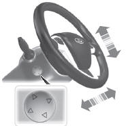Use the control on the side of the steering column to adjust the position.
