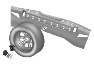 3. Stand the flat tire vertically in the mini-spare tub with the tire’s valve