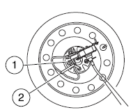 5. Use the lug wrench to remove the lug nut from the spare tire tether.