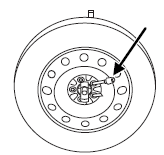 3. Lay the tire on the ground with the valve stem facing down. If your vehicle